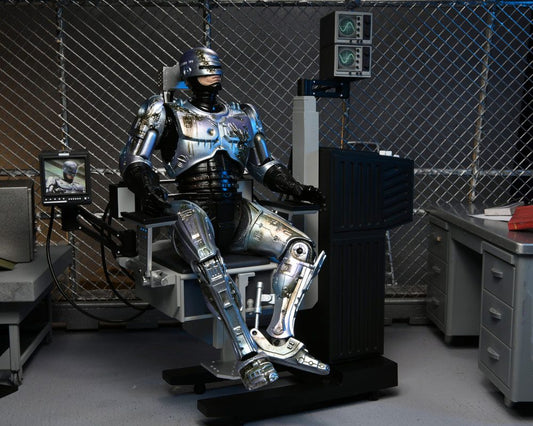 RoboCop Actionfigur Ultimate Battle Damaged RoboCop with Chair 18 cm - Preorder - ETA: 16.02.2026