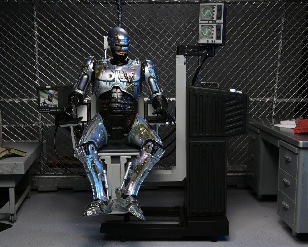 RoboCop Actionfigur Ultimate Battle Damaged RoboCop with Chair 18 cm - Preorder - ETA: 16.02.2026