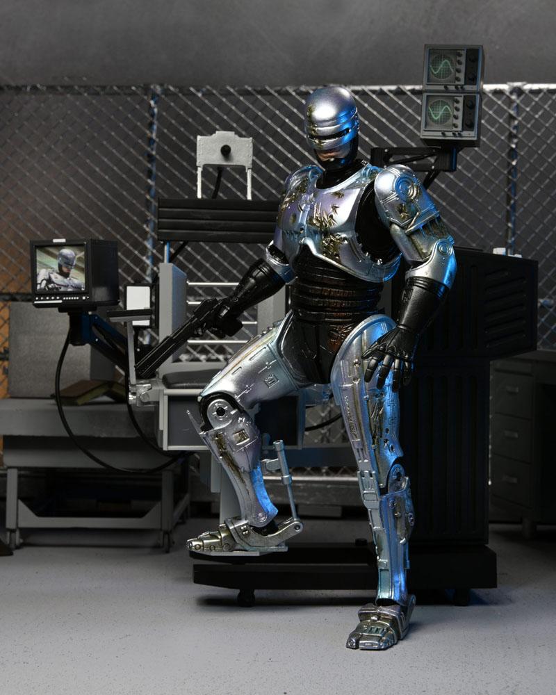 RoboCop Actionfigur Ultimate Battle Damaged RoboCop with Chair 18 cm - Preorder - ETA: 16.02.2026
