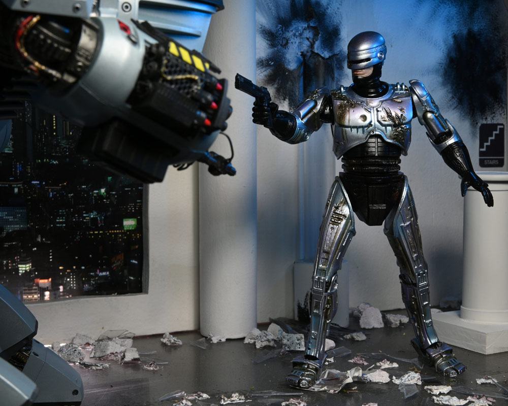 RoboCop Actionfigur Ultimate Battle Damaged RoboCop with Chair 18 cm - Preorder - ETA: 16.02.2026