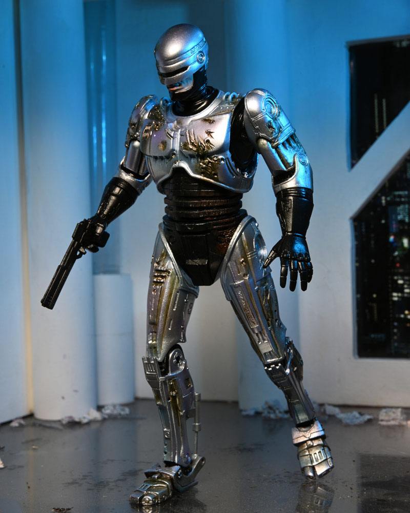 RoboCop Actionfigur Ultimate Battle Damaged RoboCop with Chair 18 cm - Preorder - ETA: 16.02.2026